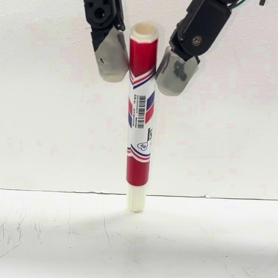 A marker held upright between two fingertips
